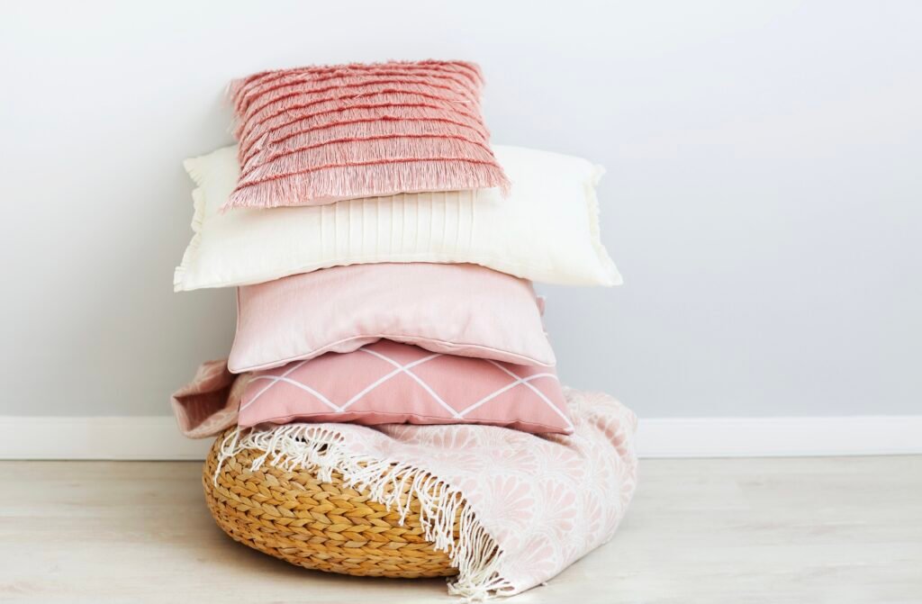 pink and white stacked throw pillows